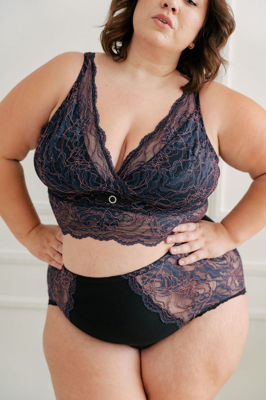 Fuller bust woman wearing blue and pink longline bra. #color_iris